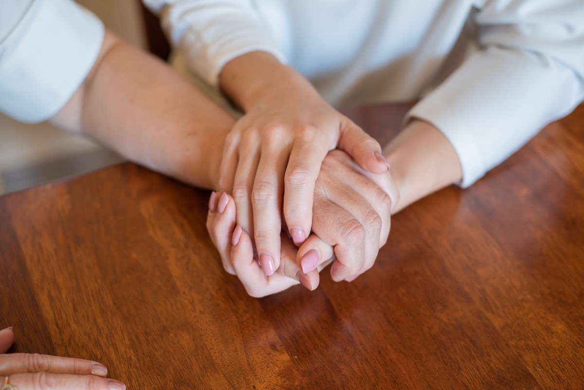 Mother and daughter holding hands