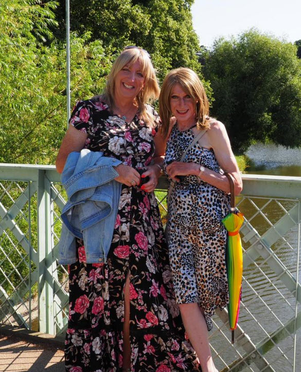 2 Beaumont Ladies standing in fon a bridge in a country setting